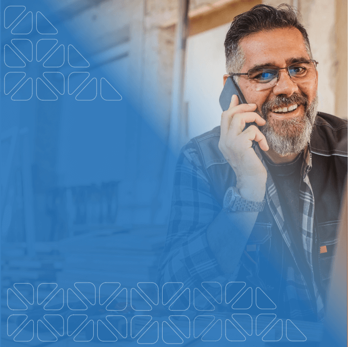 Middle age man with glasses and beard using cell phone to make call