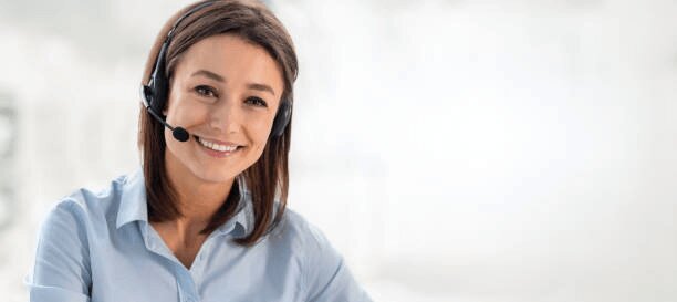 Woman with headset in a light blue shirt