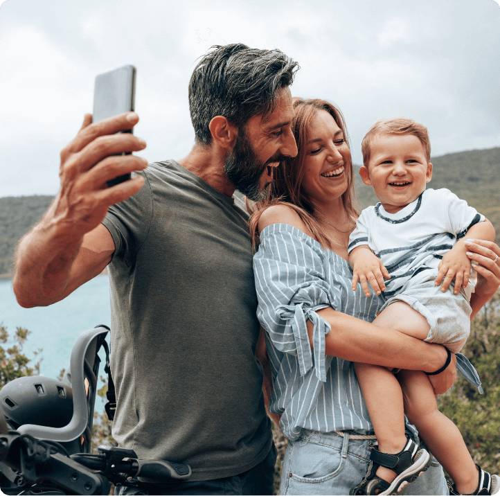 Family taking a selfie with a baby